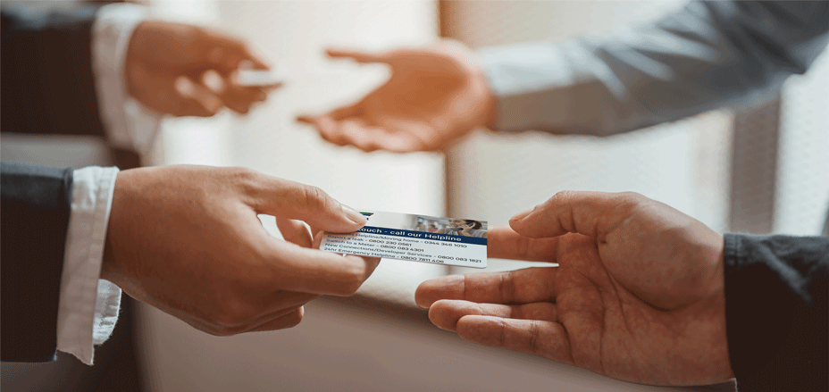 Two businessmen exchanging business cards.