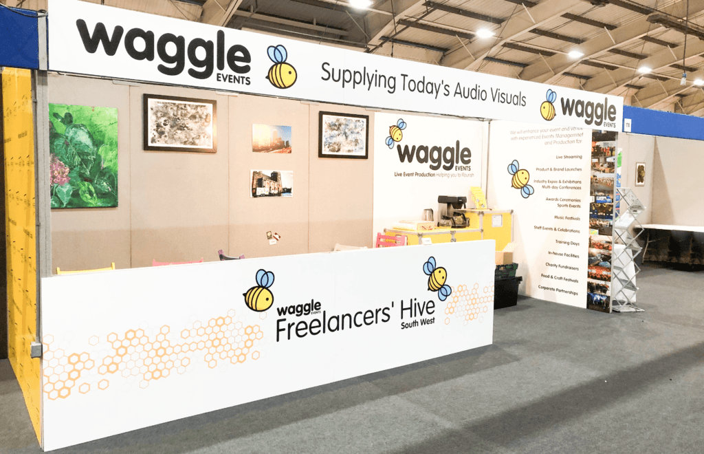 An exhibition stand for Waggle Events, with header and display boards and plenty of space for inviting potential customers